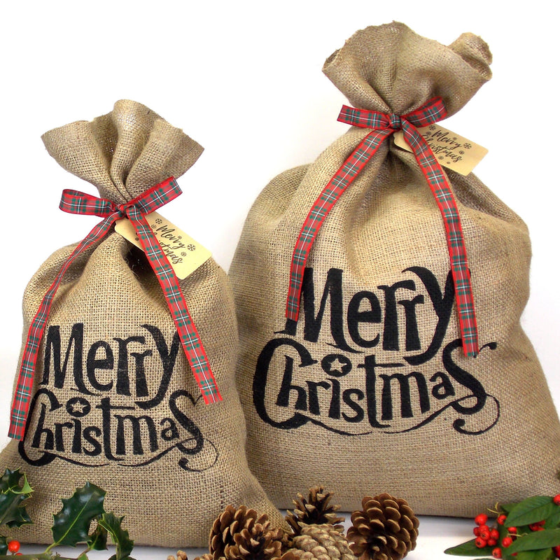 Shows both Small and Medium sized Black Merry Christmas Hessian Sacks with Tartan Ribbon & Gift Tag